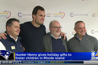 WBZ TV highlights New England Patriots Tight End Hunter Henry giving out holiday gifts